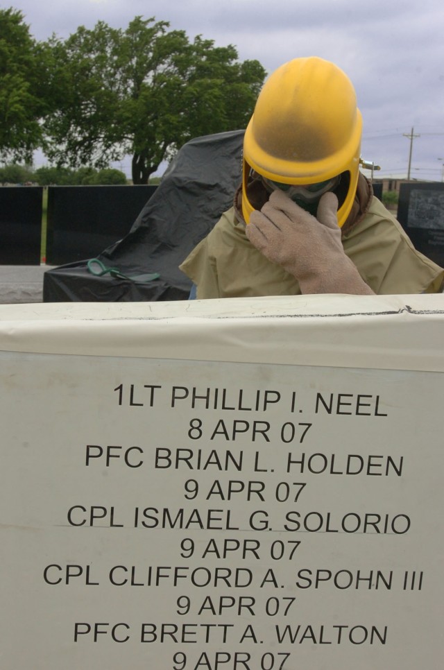Wayne Smith with the Waco, Texas-based monument business Phipps Memorial adds names of fallen Soldiers who made the ultimate sacrifice during Operation Iraqi Freedom 06-08 at the 1st Cavalry Division's OIF memorial beside Fort Hood, Texas's Cooper Fi...