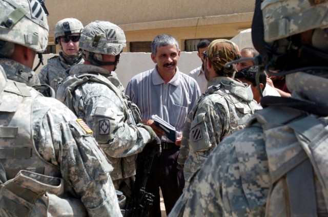 Soldiers Distribute School Supplies in Kalsu