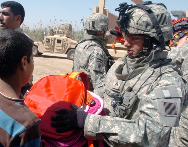 Soldiers Distribute School Supplies in Kalsu