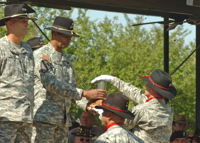 The outgoing commanding general of the 1st Cavalry Division, Brig. Gen. (P) Vincent K. Brooks of Alexandria, Va., receives the last round fired during the First Team's Change of Command Ceremony held at Cooper Field April 29. Brooks and his wife, Car...