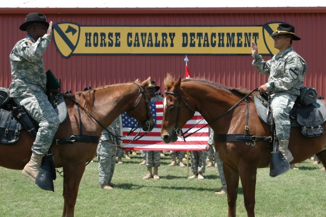 Florida native, Capt. Devin Burns (left), commander of Company F, 2nd Battalion, 5th Cavalry Regiment re-enlists Spc. Rigoberto Saenz, a Co. F Bradley Fighting Vehicle mechanic who hails from Paramount, Calif., during a ceremony at the Fort Hood Hunt...