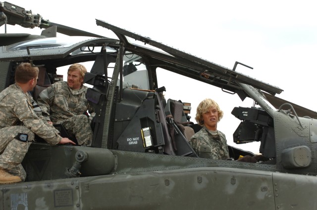 Veteran actor Ricky Schoder and son Luke (right), take the pilot and co-pilot seat in the Apache AH-64 helicopter during a visit to Fort Hood, Texas, May 1. Before boarding the craft and getting a look at a working Apache, Schroder and his son...