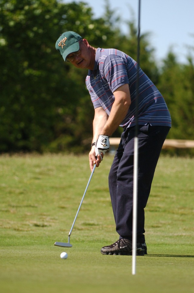 Sgt. 1st Class, Edward Sharp, with 4th Squadron, 9th Cavalry Regiment, 2nd Brigade Combat Team, 1st Cavalry Division, practices his putting after finishing his round of golf during the Black Jack Golf Scramble at the Clear Creek Golf Course on...