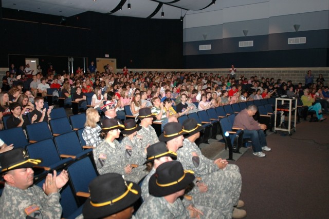 Soldiers from 615th Aviation Support "Cold Steel" Battalion, 1st Air Cavalry Brigade, 1st Cavalry Division, get ready to take the stage for students and faculty at Midway High School in Waco, Texas, during a ceremony May 9. The Midway Panthers...