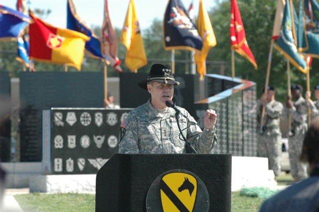 Former commanding general of the 1st Cavalry Division, Lt. Gen. Joseph F. Fil, Jr., of Portola Valley, Calif., speaks to Gold Star families, friends and troopers of the heavy-armored division, during a rededication ceremony held at Cooper Field May 1...