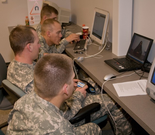 Soldiers assigned to the 4th Brigade Combat Team, 1st Cavalry Division, watch an instructional video before providing saliva samples for DNA collection at the University of Texas. The Soldiers volunteered for a battery of tests designed to track how ...