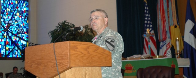 Chaplain (Lt. Col.) Steve Walsh (center), the 1st Cavalry Division's outgoing chaplain, speaks at a changing of the stole ceremony at the division's memorial chapel May 20. Walsh thanked many people including his noncommissioned officer-in-charge...