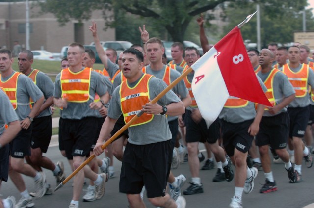 Running alongside his fellow Company A, 2nd Battalion, 8th Cavalry Regiment troopers, Los Angeles native Sgt. Valentine Arreola, a Co. C team leader, carries the guidon for his company during the 1st "Ironhorse" Brigade Combat Team, 1st Cavalry...