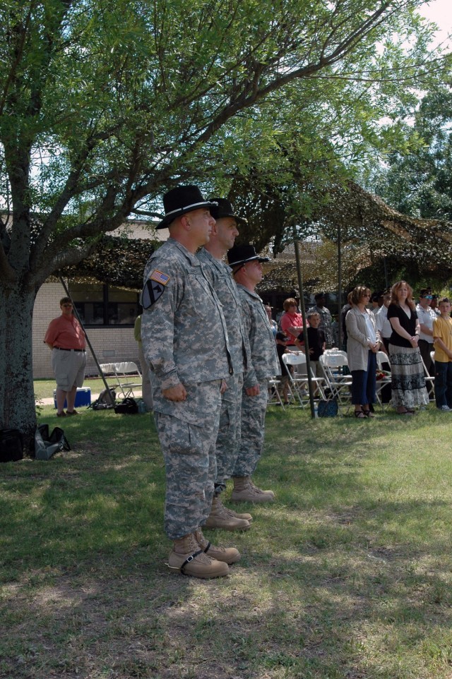 Left to Right: The 1st Cavalry Division band's outgoing commander Chief Warrant Officer 4 Glen Nardin, the Division Special Troops Battalion commander Lt. Col. Matthew G. Karres and the band's incoming commander Chief Warrant Officer 4 Aaron Graff...