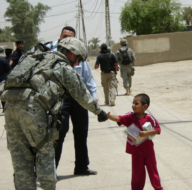 Soldiers, Police Provide Pens, Smiles to Iraqi Children