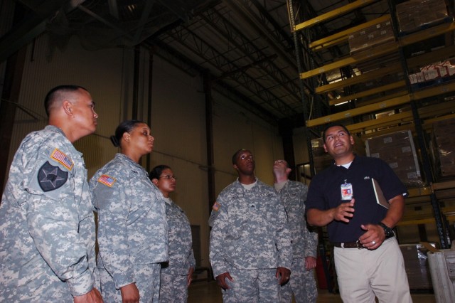 Jeremy Gaytan, an Operations Manager with the Wal-Mart Distribution Center in New Braunfels, Texas, gives a tour of the facility to Soldiers from Company A, 15th Brigade Support Battalion, 2nd Brigade Combat Team, 1st Cavalry Division June 3. The dis...