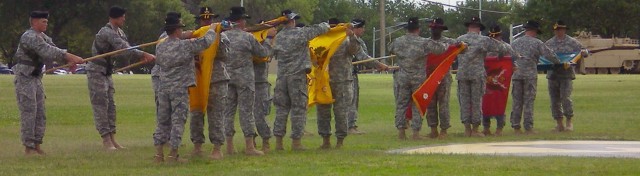 The 4th "Long Knife" Brigade Combat Team, 1st Cavalry Division battalion commanders and command sergeants major case their unit colors during the brigade's color casing ceremony at Cooper Field June 4. The Long Knife Brigade is scheduled to deploy...