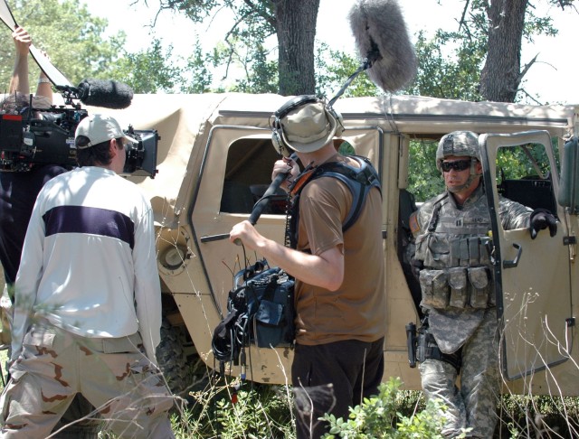 Capt. Ashton J. Read, commander of Battery A, 2nd Battalion, 82nd Field Artillery Regiment, 3rd Brigade Combat Team, 1st Cavalry Division from Westminster, Md., is interviewed by The Military Channel at Ft. Hood, Texas, June 3. This crew of...