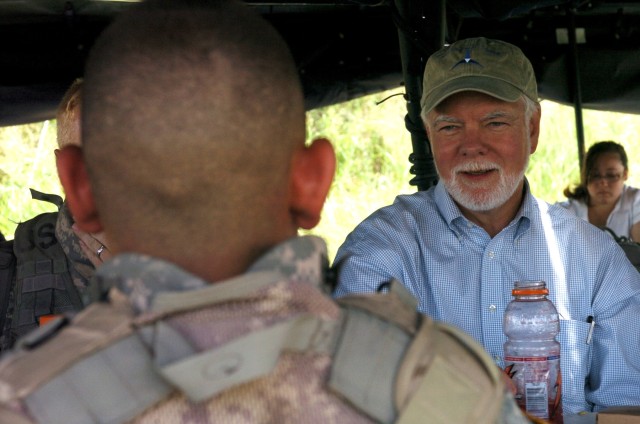 Chicopee, Mass. native Spc. Maxmiiliaan Vanossenbruggen (foreground), Company A, 1st Battalion, 5th Cavalry Regiment, 2nd Brigade Combat Team, 1st Cavalry Division, speaks with Nelson M. Ford, the acting under secretary of the Army and assistant secr...