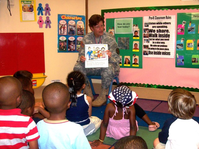 USAG commander reads to CDC children for Army Birthday