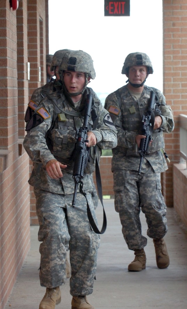 Spc. David Malone from Midlothian, Texas and Sgt. Ryan Rouhselang, a native of Dyer, Indiana native lead a raid on a building as part of the combat lifesaver training conducted by 3rd Battalion, 82nd Field Artillery Regiment, 2nd Brigade Combat Team,...