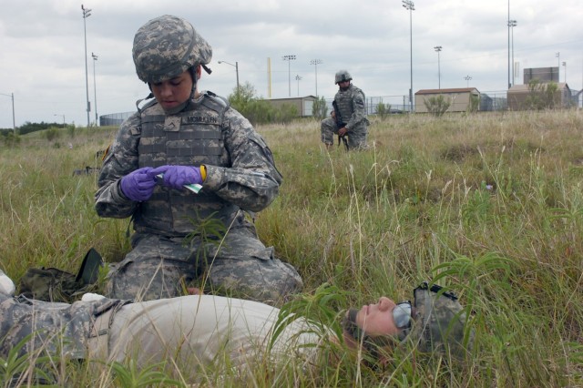 Pvt. Casey McMullen, a native of Arnold, Calif. who is assigned to Battery G, 3rd Battalion, 82nd Field Artillery Regiment, 2nd Brigade Combat Team, 1st Cavalry Division, prepares an IV for a simulated casualty during combat lifesaver training at For...