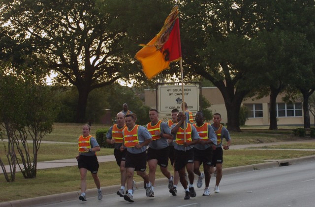 Col. Ryan Gonsalves, the commander of the 2nd Brigade Combat Team, 1st Cavalry Division runs with members of his staff while leading his Soldiers on a brigade run June 12 at Fort Hood, Texas. The Black Jack Brigade conducted the run in celebration...