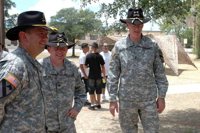 Major General Daniel Bolger (right), the commanding general for the 1st Cavalry Division, talks with Col. Douglas Gabram (center), commander of the 1st Air Cavalry "Warrior" Brigade, 1st Cav. Div., and Command Sgt. Maj. Glen Vela (left), the...