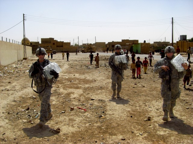 U.S. Army, Europe Field Artillery Soldiers help displaced Families in Iraq