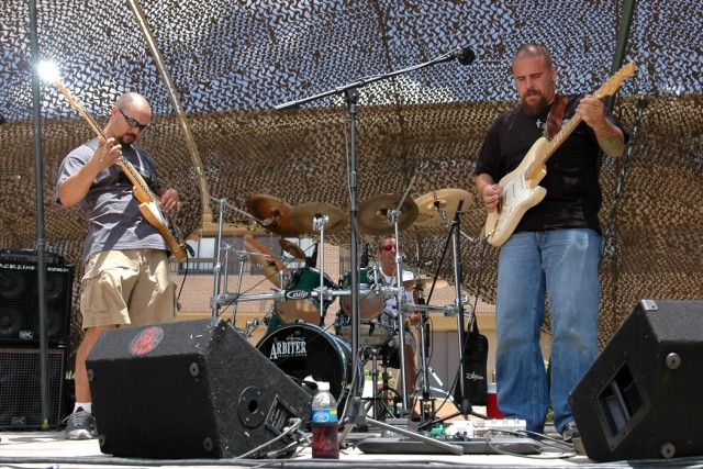 Local band, Lazy J and the Dirty Shuffle, play during a farewell party for the 404th  Brigade Support Battalion, 4th Combat Aviation Brigade, 4th Infantry Division, June 12 at Fort Hood, Texas, hosted by their sister unit, the 615th Aviation Support ...