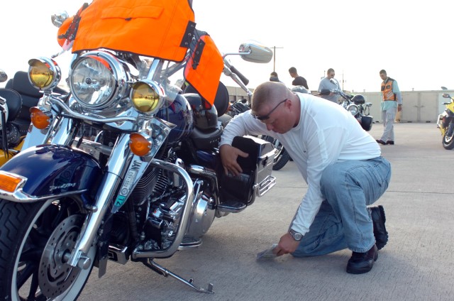 Midland, Texas native Sgt. 1st Class Michael Morgan, first sergeant for Company C, 115th Brigade Support Battalion loads his saddle bags during the motorcycle inspection prior to the Ironhorse Bike Stampede June 12 at Fort Hood, Texas.  The...