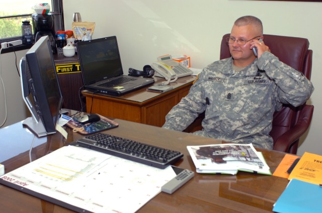 Campbellsburg, Ind. native Command Sgt. Maj. Rory L. Malloy, the 1st Cavalry Division's new command sergeant major, takes a call in his office June 10 at Fort Hood, Texas. As command sergeant major, Malloy said some of his goals will be to ensure...