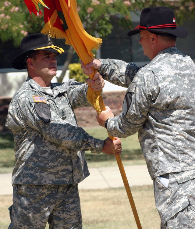 Command Sgt. Maj. Thomas Boon (right), of 2nd Battalion, 82nd Field Artillery Regiment, 3rd Brigade Combat Team, 1st Cavalry Division from San Antonio, Texas and Command Sgt. Maj. James Pippin, the brigade's new command sergeant major from Archer Cit...