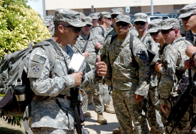 The first sergeant of Troop D, 2nd Squadron, 7th Cavalry Regiment, 1st Sgt. Ricardo Luera (far left), who hails from Edinburg, Texas, addresses his troops at Fort Hood, Texas prior to their June 16 departure to Kuwait for training as part of a 15-mon...