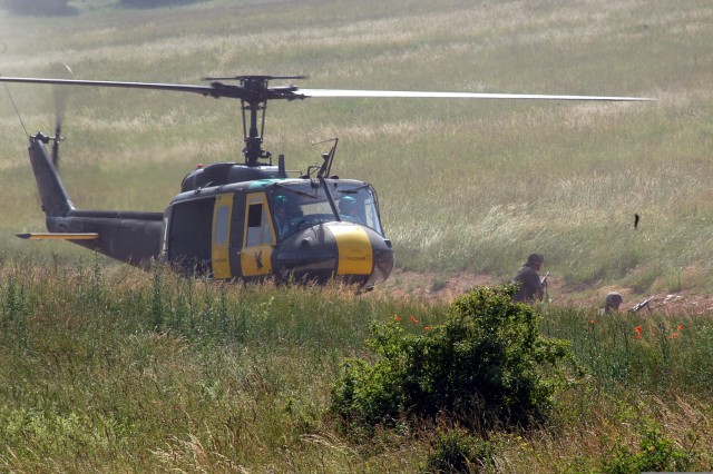 080625-A-8410F-006 (soldiers waiting on the side of the chopper as it takes off)