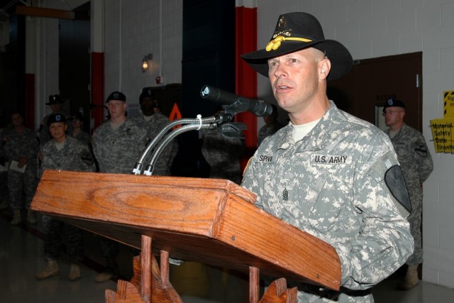 Sutter Creek, Calif., native Command Sgt. Maj. Scott Spiva, outgoing command sergeant major of the 1st Air Cavalry "Warrior" Brigade, 1st Cavalry Division, speaks during a change of responsibility ceremony at Gray Army Air Field, Fort Hood, Texas, Ju...