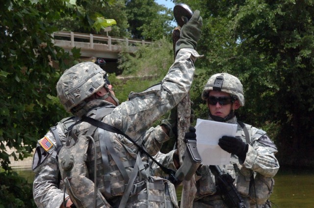 Soldiers with Company E "Sappers", 2ndBattalion, 8th Cavalry Regiment, 1st Brigade Combat Team, 1st Cavalry Division measure the depth of a ford they cross during dismounted training at Fort Hood, Texas June 26. The Sappers are a mechanized...