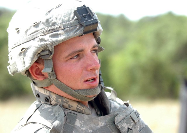 Pvt. John Johnson with Company F, 215th Brigade Support Battalion, 3rd  Brigade Combat Team, 1st Cavalry Division from Hornbeak, Tenn. takes a break from the hard work that goes along with managing the ammunition transfer point on Fort Hood, Texas Ju...