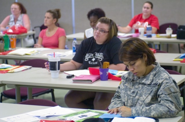 Las Cruces, N.M. native Staff Sgt. Celestina De La Cruz (right), acting first sergeant for Company B, 201st Brigade Support Battalion Rear Detachment takes notes during an Army Family Team Building (AFTB) class July 2 on Ft. Hood, Texas. There are th...