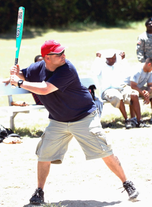 Staff Sgt. Patrick Bingham, with Headquarters and Headquarters Battery, 2nd Battalion, 82nd Field Artillery Regiment, 3rd Brigade Combat Team, 1st Cavalry Division from St. Charles, Mo. represents his battery in a game of softball at Belton...