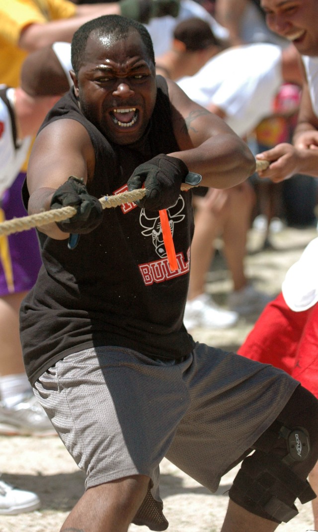 Sgt. Link Washington, with Battery B, 2nd Battalion, 82nd Field Artillery Regiment, 3rd Brigade Combat Team, 1st Cavalry Division from Lake City S.C. represents his battery by participating in a game of tug-of-war at Belton Lake Outdoor Recreation...
