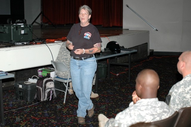 Lisa Allen from Kay's Motorcycle Mania, a local motorcycle shop, talks to Soldiers of the 1st Air Cavalry "Warrior" Brigade, 1st Cavalry Division, about motorcycle safety and quizzes them about how to properly inspect their motorcycle before a...