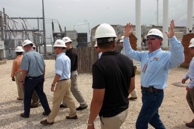 Kevin Brown, superintendent of systems operation at the Seaholm power substation in Austin, Texas, describes many of the components of a substation to Soldiers from the 2nd Brigade Combat Team, 1st Cavalry Division during their trip to the capital...
