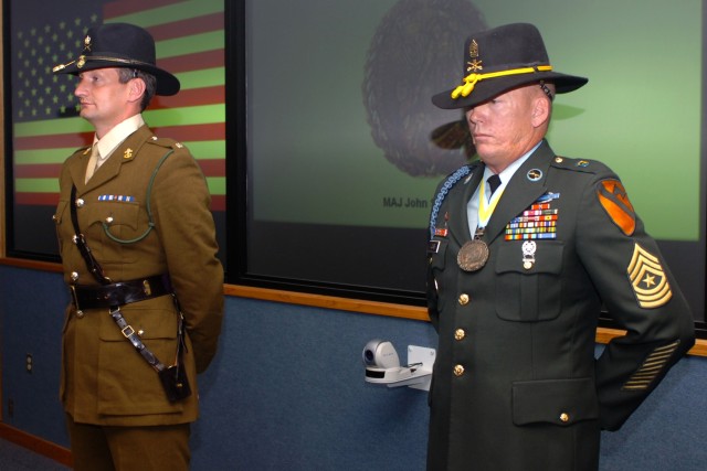 Prior to receiving the Order of St. Maurice medallion, Chalford, Gloucestershire, England native British Army Maj. John Russell, the chief of operations, 1st Cavalry Division, stands alongside the man who nominated him for the honor, Los Angeles nati...