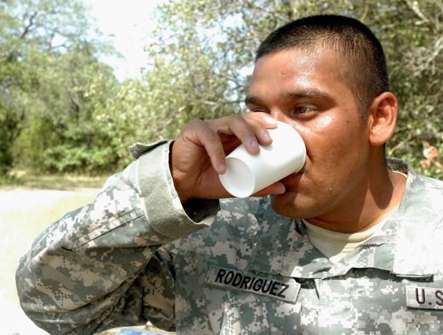 Sgt. Lou Rodriguez, with Company C, 3rd Battalion, 8th Cavalry Regiment, 3rd Brigade Combat Team, 1st Cavalry Division from Brownsville, Texas hydrates after accomplishing a timed exercise designed to expand the Soldier's self confidence by...