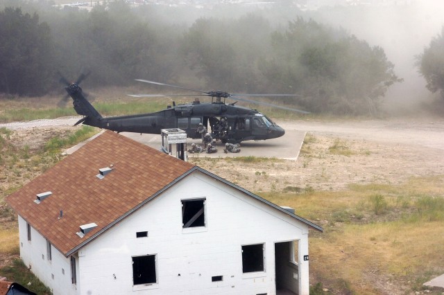 Cavalry Scouts from Troop B, 4th Squadron, 9th Cavalry Regiment, 2nd Brigade Combat Team, 1st Cavalry Division, dismount a UH-60 Black Hawk helicopter from 3rd Battalion, 227th Aviation Regiment, 1st Air Cavalry Brigade, 1st Cav. Div., during an...