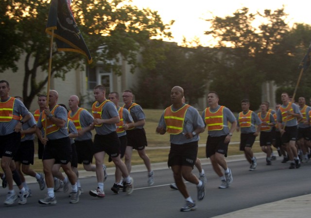 New Orleans, La. native Command Sgt. Maj. Clinton Lee Joseph Jr. (foreground), 1st Division Special Troops Battalion command sergeant major, calls cadence for his troops during the DSTB third Anniversary run July 15, at Ft. Hood, Texas. Joseph has be...