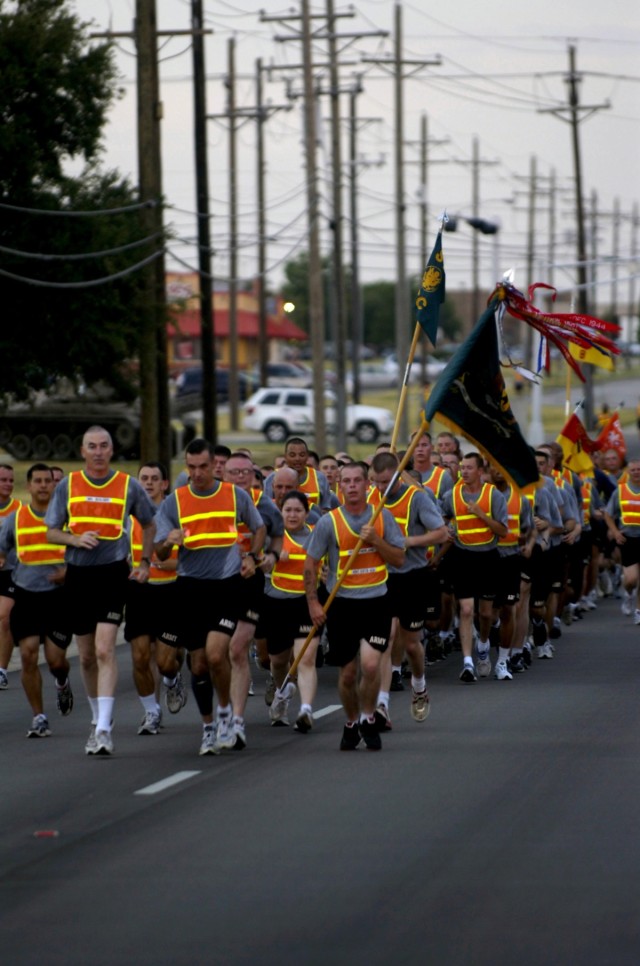 Soldiers from the Division Special Troops Battalion, 1st Cavalry Division, celebrate the Battalion's third anniversary during a battalion run July 15 at Ft. Hood, Texas led by Chapel Hill N.C. native, DSTB Commander, Lt. Col. Matthew Karres, and, Aur...