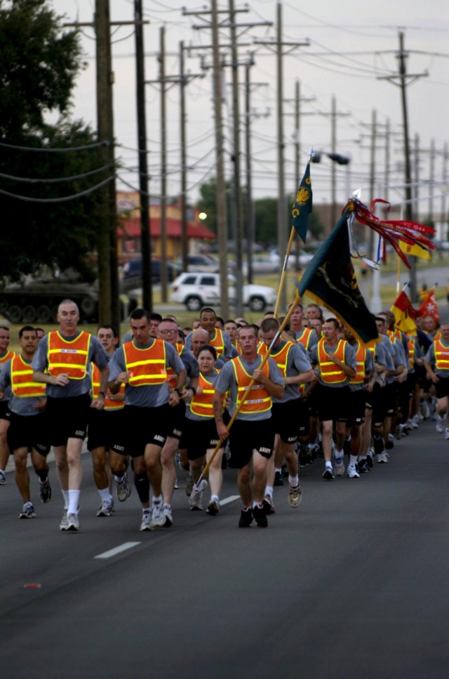 Soldiers from the Division Special Troops Battalion, 1st Cavalry Division, celebrate the Battalion's third anniversary during a battalion run July 15 at Ft. Hood, Texas led by Chapel Hill N.C. native, DSTB Commander, Lt. Col. Matthew Karres, and,...