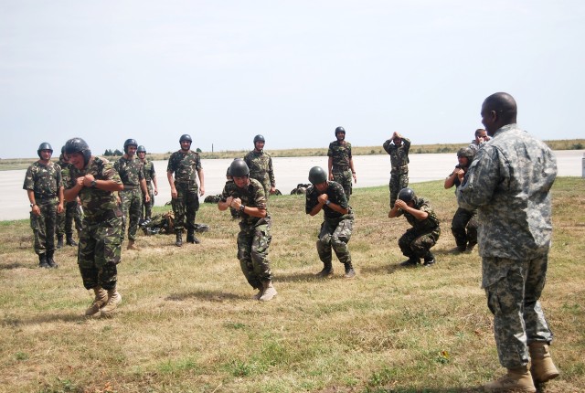 U.S. paratroopers share airborne skills with Romanian counterparts