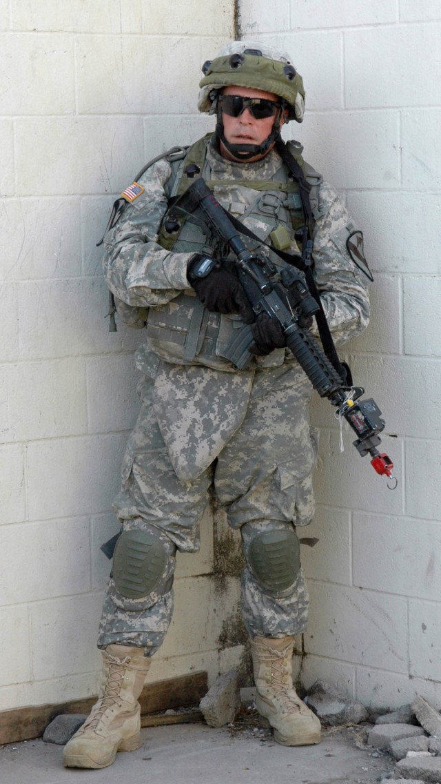 Pfc. Brian Meyers, an infantry Soldier with A Co., 3-8 Cav., 3rd BCT, 1st Cav. Div., prepares to clear rooms as part of a training exercise on Fort Hood July 17. 3rd BCT Soldiers have taken part in training since July 14 in preparation for it's...