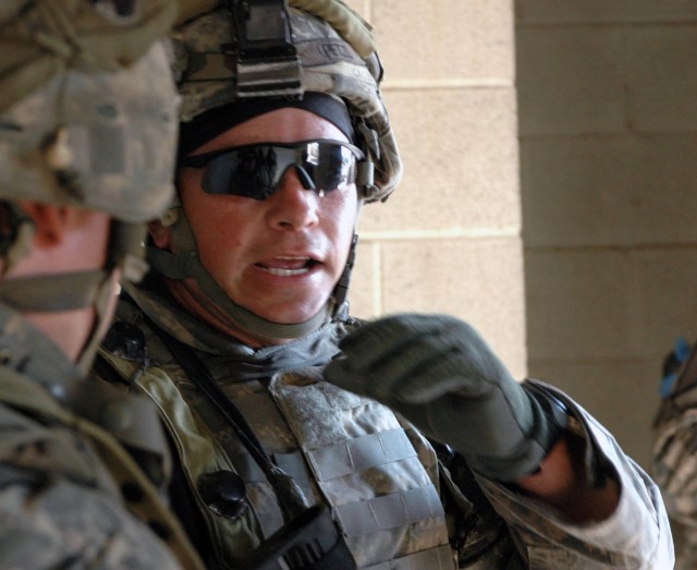 Staff Sgt. Charles Schnitz, a platoon sergeant with A Co., 3-8 Cav., 3rd BCT, 1st Cav. Div., from Nixon, Texas, instructs one of his Soldiers on their plan of action as part of a training event on Fort Hood July 17. This exercise is part of a...