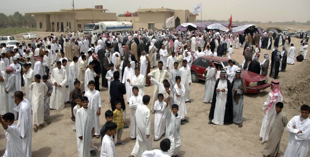 More than 500 sheikhs mingle outside a tent during an annual meeting to discuss issues concerning their tribes and upcoming elections in Samawa July 16. The sheikhs from the southern provinces also met with leaders from the 2nd Sqdn., 12th Cav. Regt....