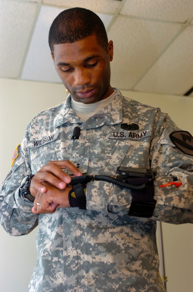 Hearne, Texas native, Chief Warrant Officer 2 Levar Wilson, a brigade intelligence officer for the 1st Air Cavalry Brigade, 1st Cavalry Division, checks out the Vcommunicator, a translation device, during a demonstration of the capability July 22 at ...
