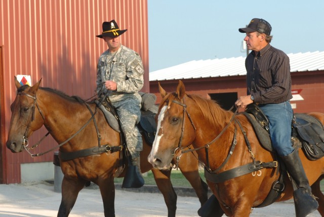 Sgt. Maj. of the Army Kenneth O. Preston rides alongside Larry Borth, a training instructor and stable master for the Horse Cavalry Detachment, 1st Cavalry Division, during an Aug. 4 visit by Preston to Fort Hood, Texas.  Also on horseback, the 1st C...